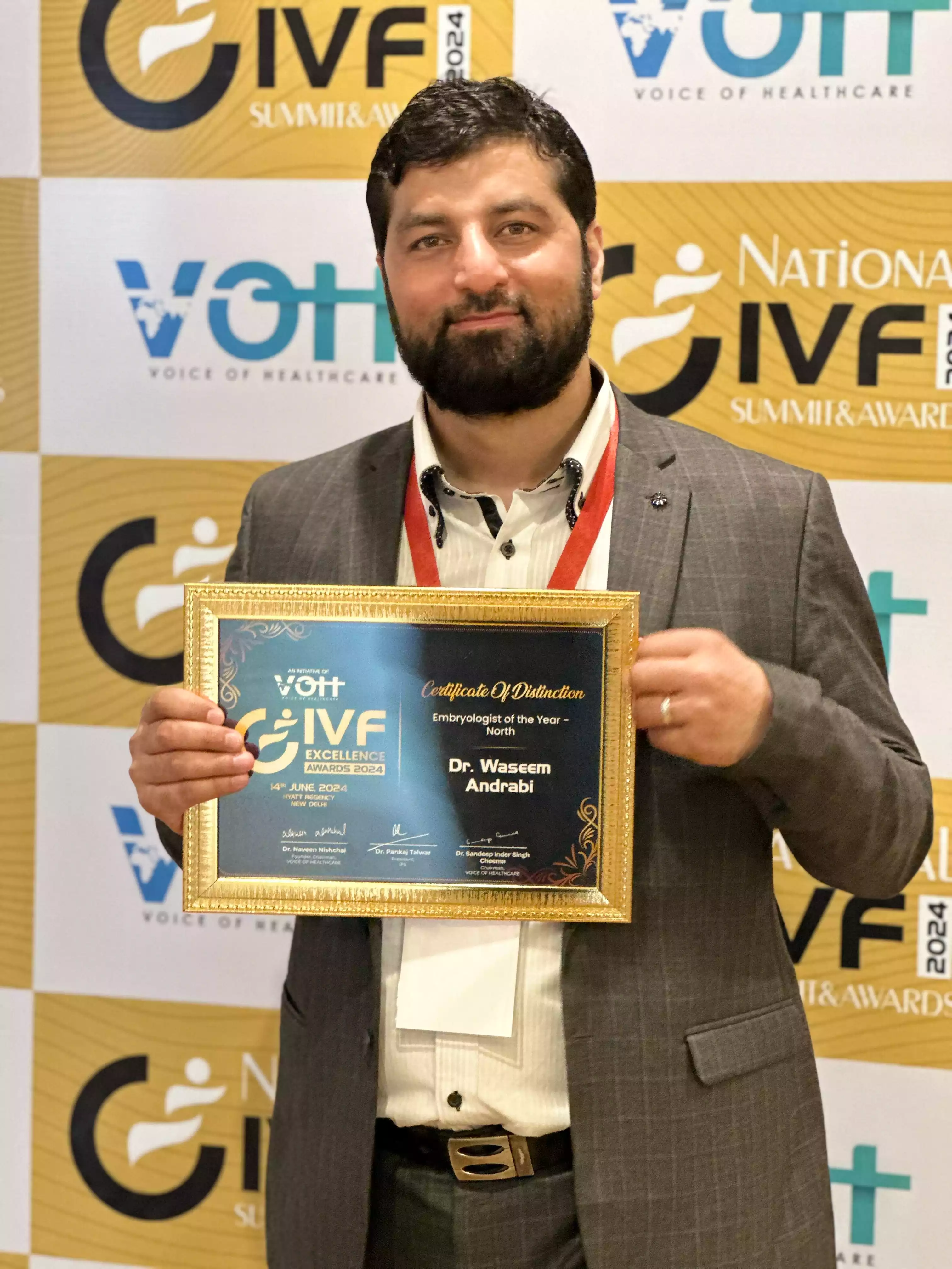 Dr. Waseem Andrabi with Award